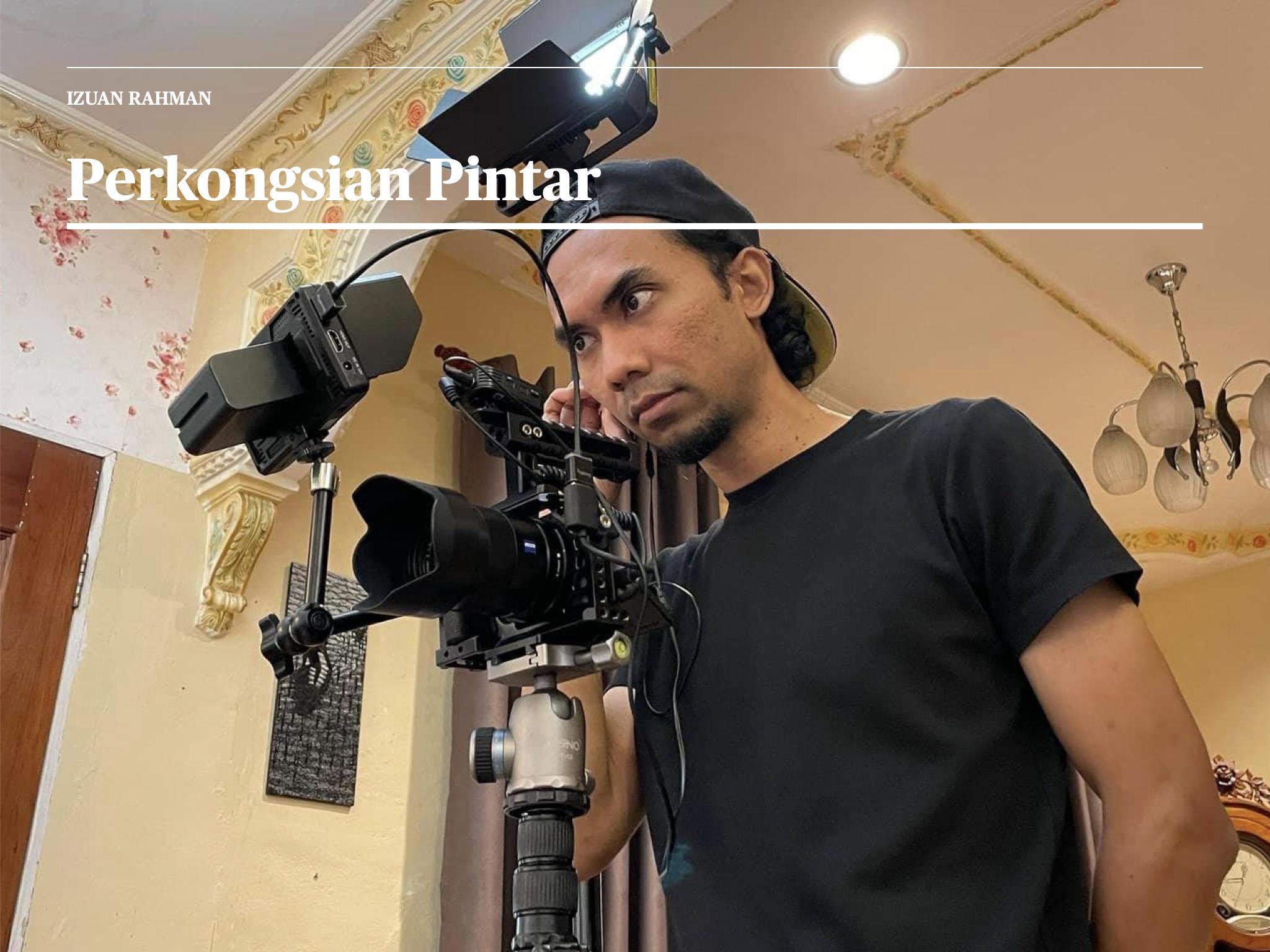 Izuan Rahman operating a video camera